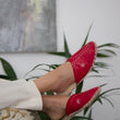 Load image into Gallery viewer, Leather handmade Egyptian slippers, ruby red leather on top and tan leather sole, white hand stitching through the red leather, pointed toe and flat sole