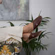 Load image into Gallery viewer, Leather handmade Egyptian slippers, chocolate brown leather on top and tan leather sole, white hand stitching through the brown leather, pointed toe and flat sole